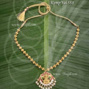 Devi Alangaram with Beautiful pattern of red kemp stones adorning the waist belt. Temple jewelry Vadaanam.