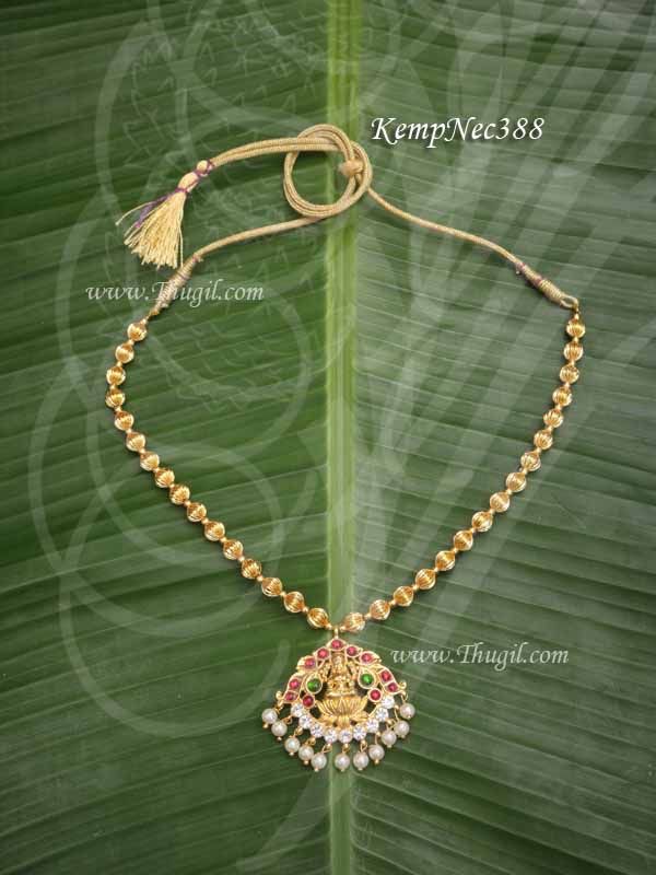 Devi Alangaram with Beautiful pattern of red kemp stones adorning the waist belt. Temple jewelry Vadaanam.